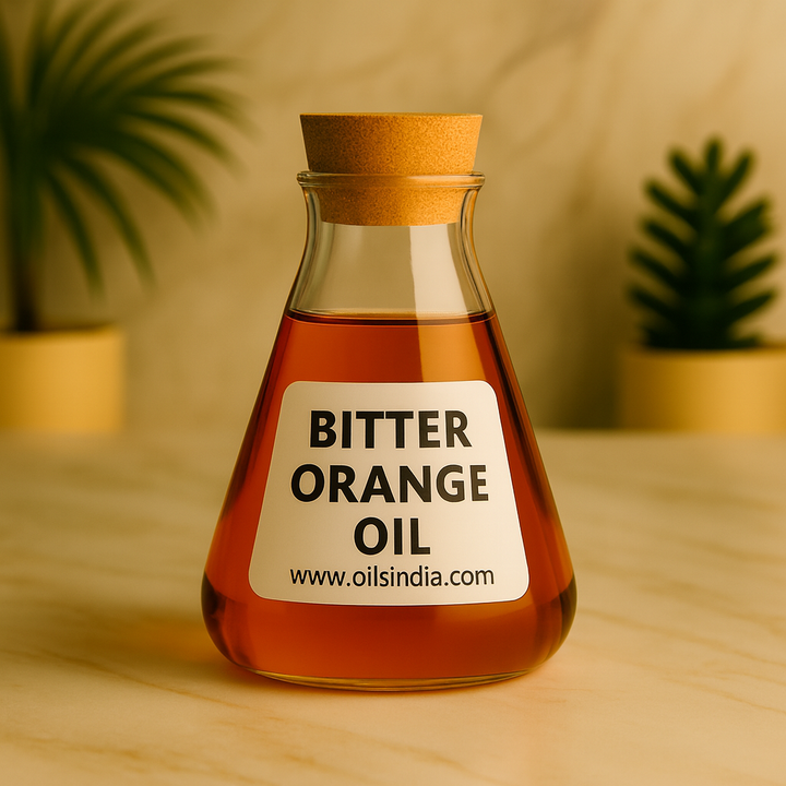 Bottle of bitter orange oil with a cork lid on a wooden surface, plants in the background.