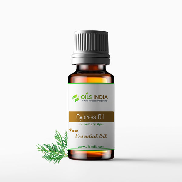 A bottle of Cypress Essential Oil with a white label, brand name 'Oils India', and an image of a cypress leaf on the front. The bottle is filled with clear liquid and has a black cap.