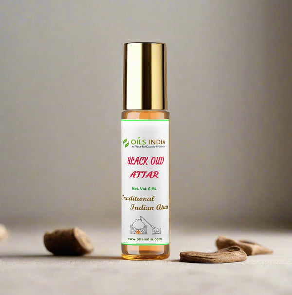 Bottle of Black Oud Attar from Oils India on a beige background
