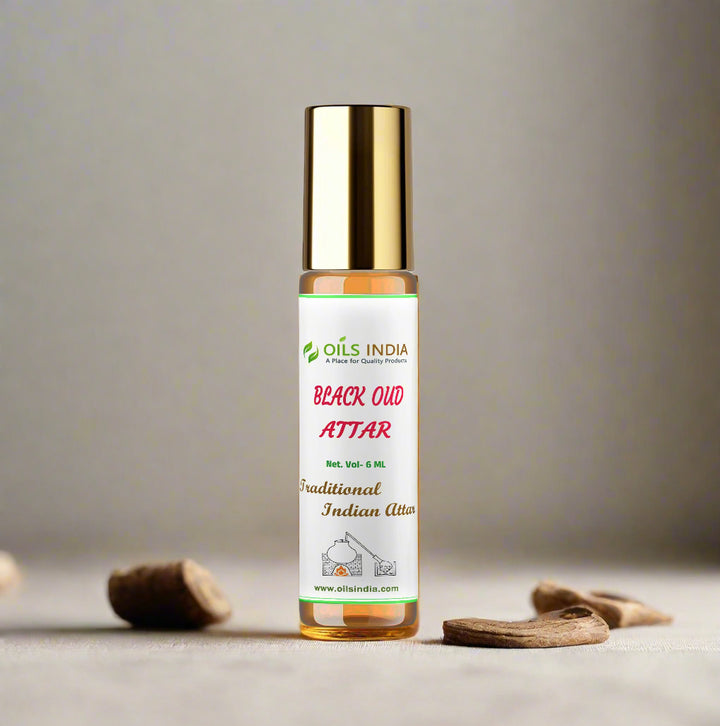 Bottle of Black Oud Attar from Oils India on a beige background