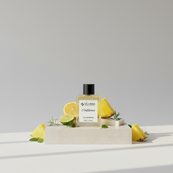 Perfume bottle labeled 'Confidence' by ' oils of india' with bergamot, oakmoss, lemons on a light gray background