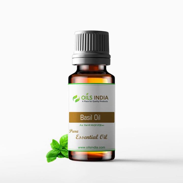 Bottle of Basil Essential Oil with basil leaf by Oils India on a white background