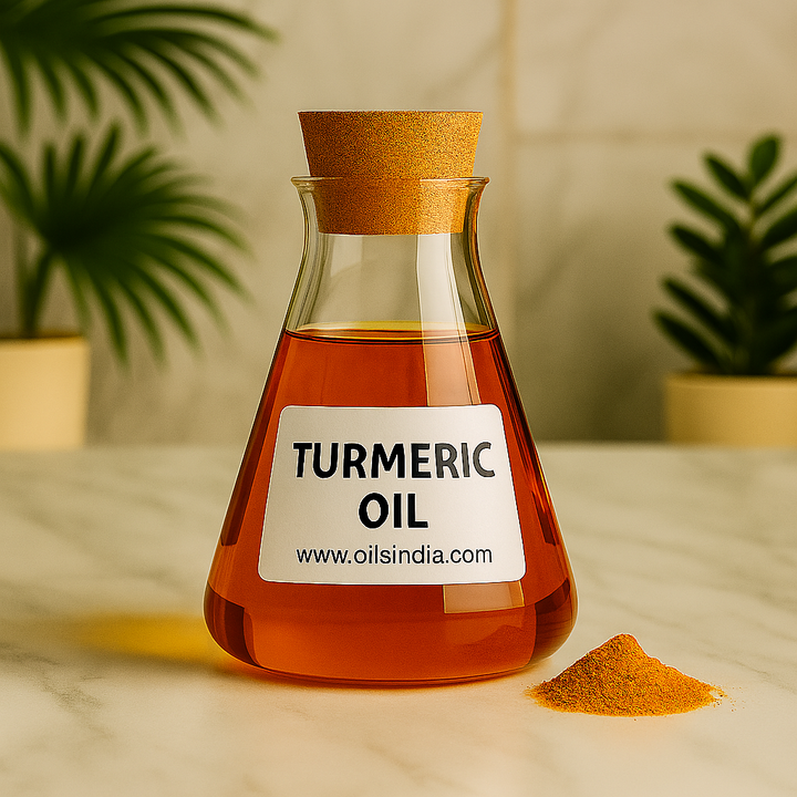 Bottle of turmeric oil with a label and turmeric powder on a marble surface.